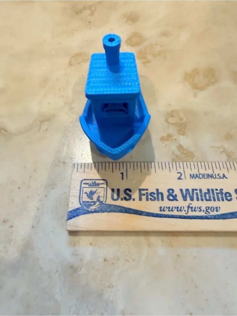 Small 3D-Printed Toy Boat in Bright Blue